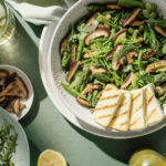 Green summer salad with halloumi cheese, garlic mushrooms, asparagus, and arugula